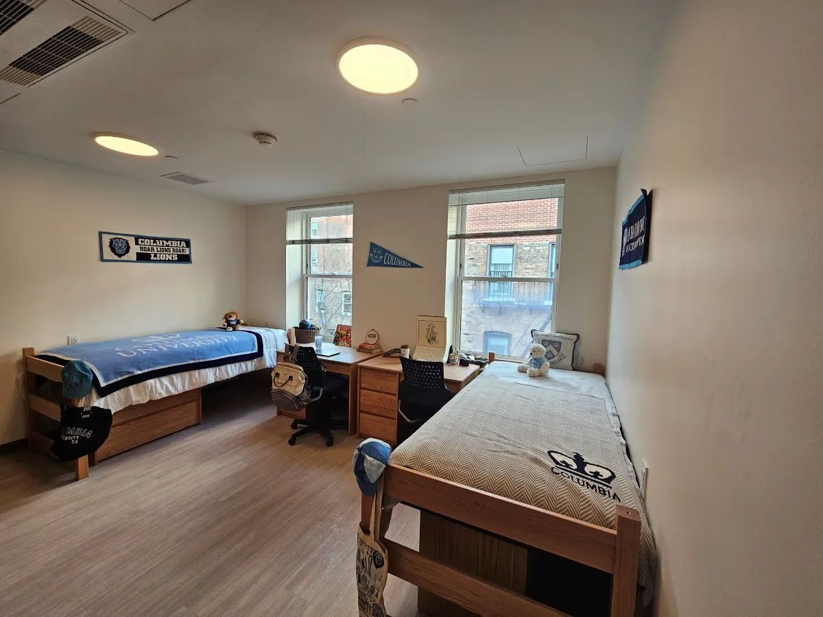 Double room showing two beds and two desks