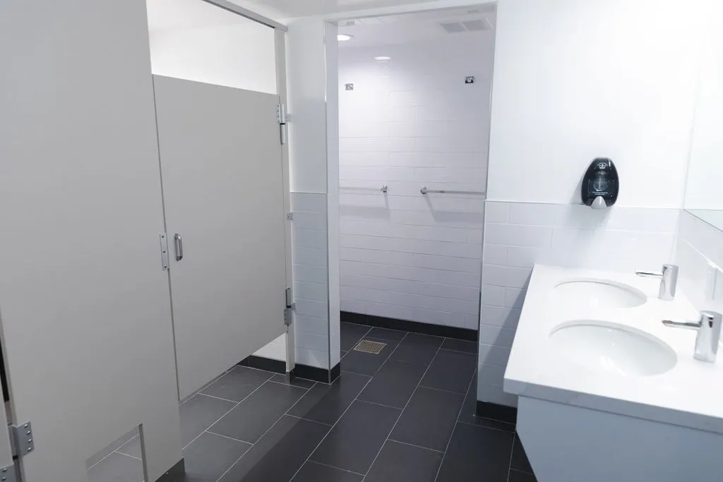 Shared bathroom with stalls