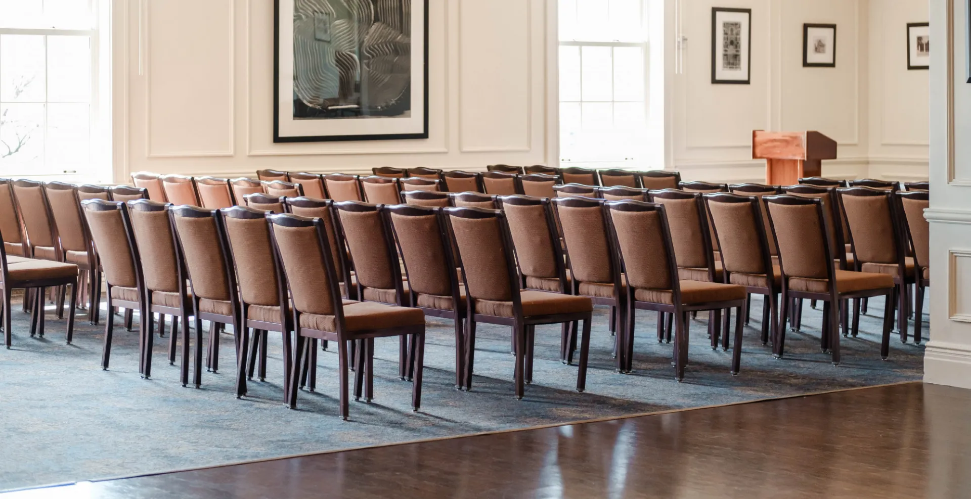 Room filled with chairs and podium