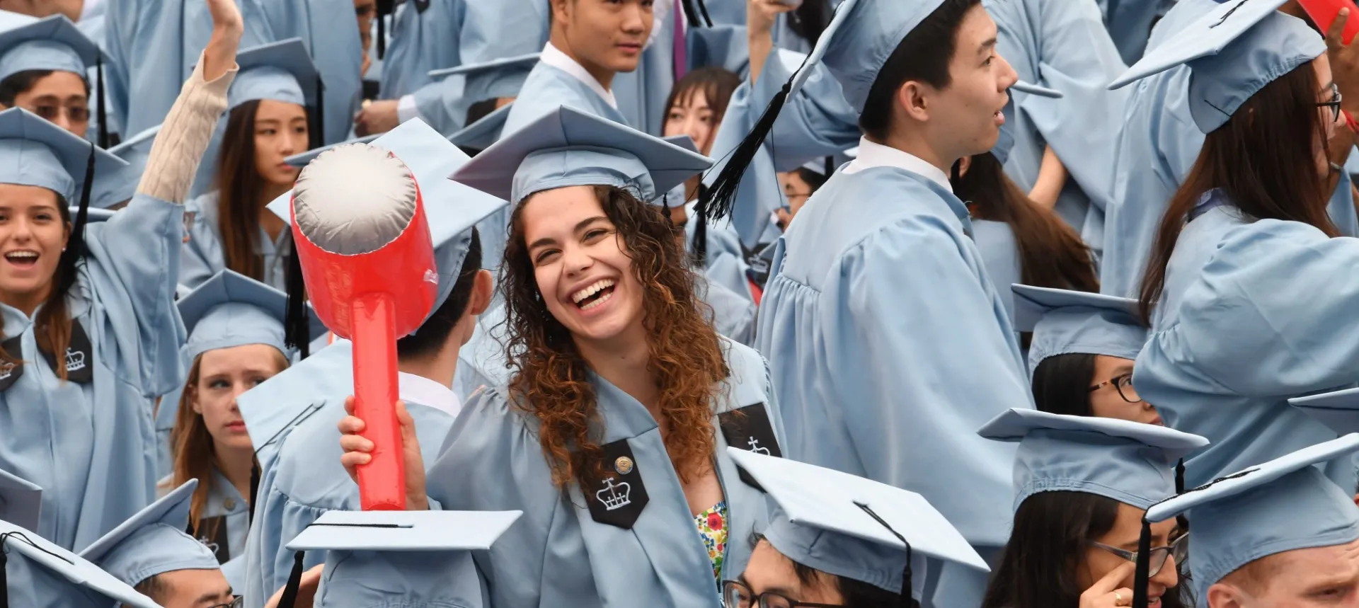 Students smiling and celebrating at Columbia University Commencement