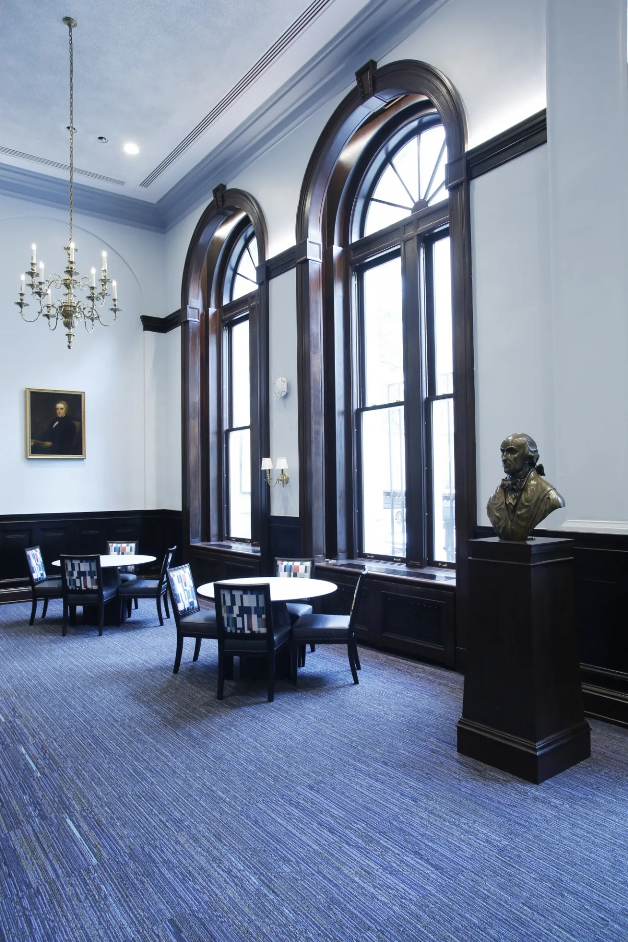 A bronze bust of John Jay on a pedestal in John Jay Lounge.
